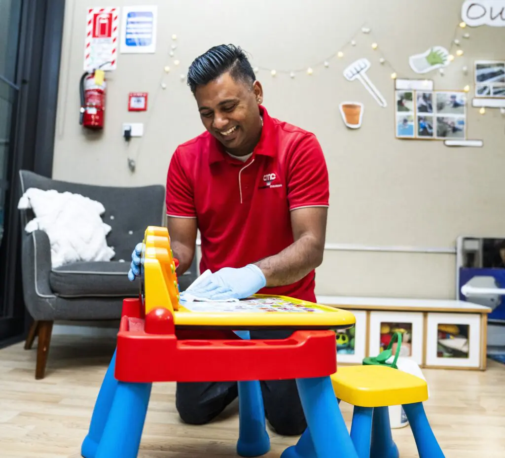 childcare centres cleaning toys and desk 