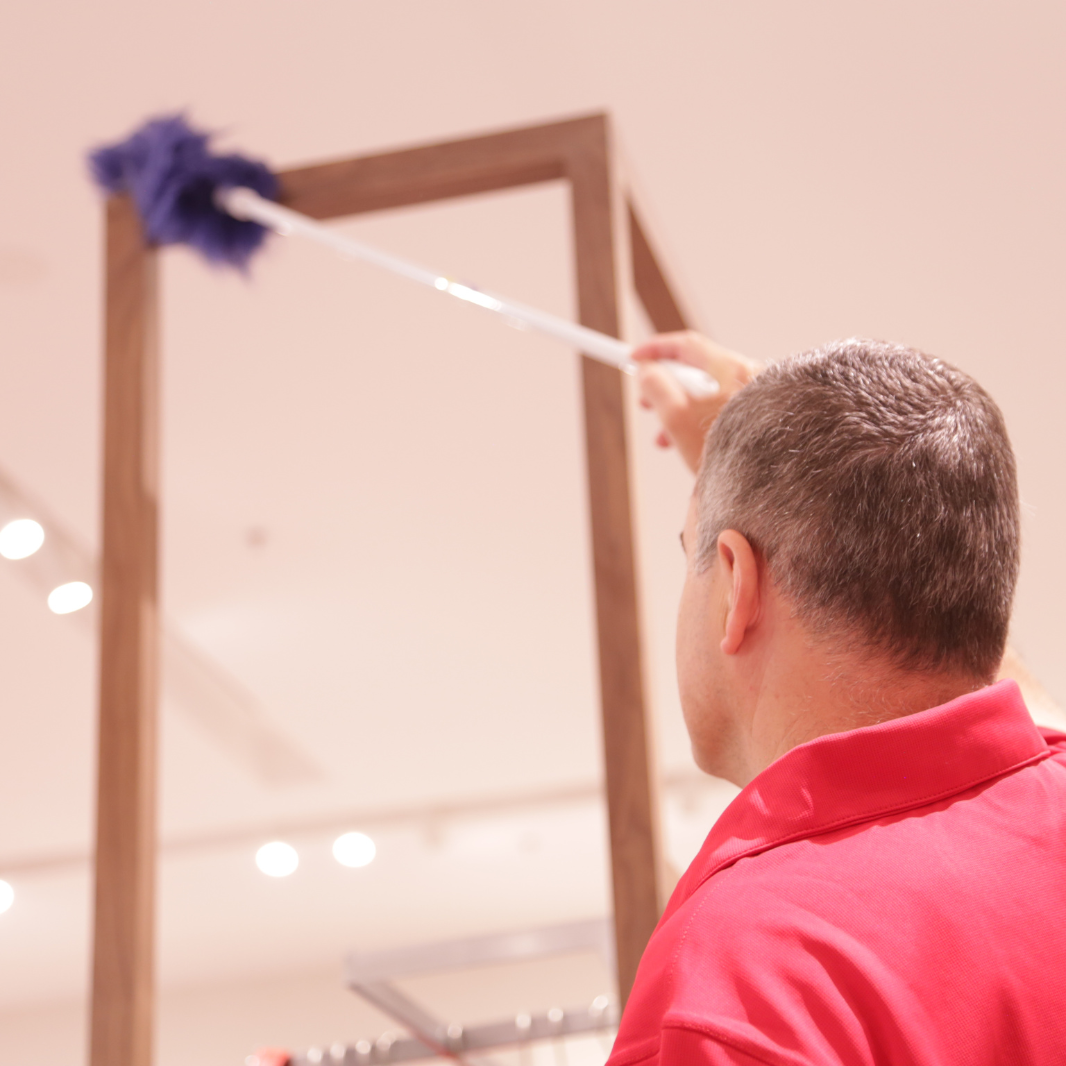 amc cleaner cleaning vertical surfaces with a High-reach duster