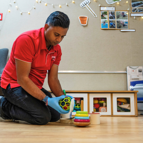 Commercial cleaner sanitising children’s toys at a childcare centre to maintain hygiene and safety