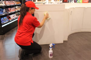 AMC cleaner at Retail cleaning the surfaces